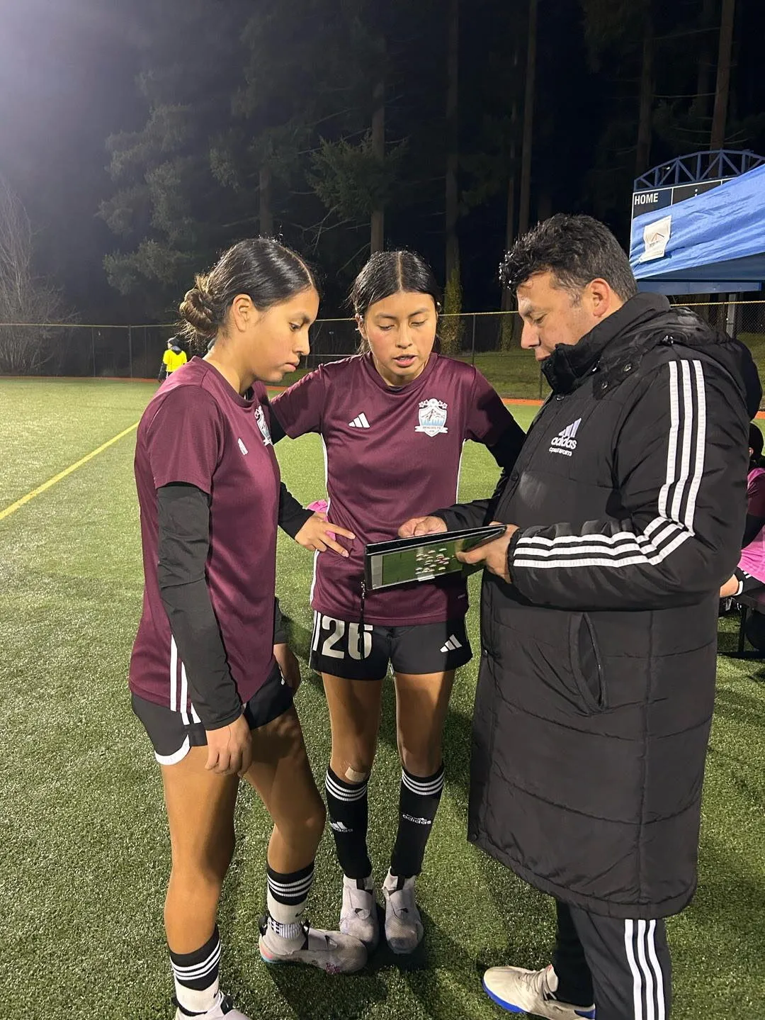 Coach Javier with the Genesis FC girls soccer team in Gresham